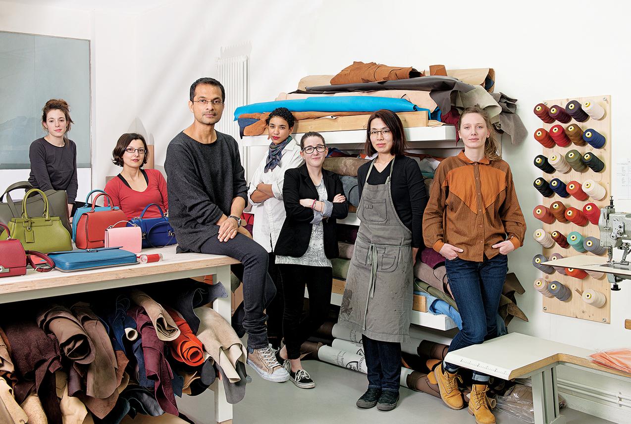 Portrait of Ramesh Nair and his team in Moynat studio. Rue de la Sourdière, Paris, France . March 23, 2015