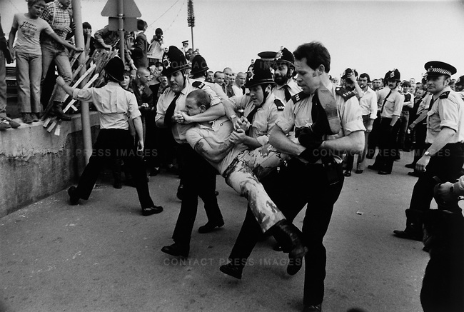 Police breakup a fight between “Skinhead” and “Mod” teenagers, Southend, UK, circa 1981