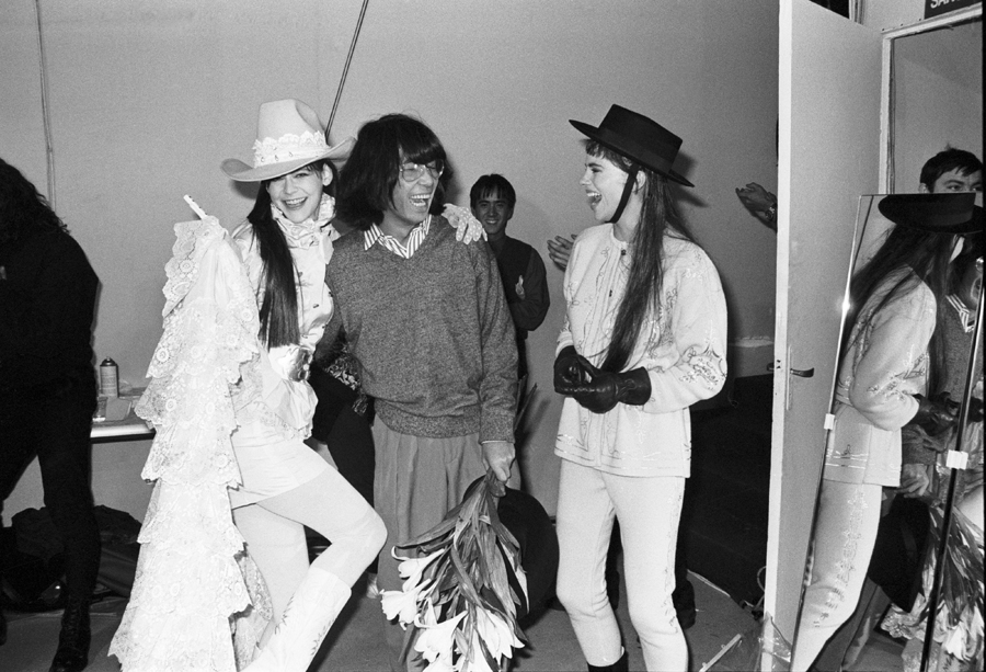 Kenzo Takada enjoying a moment backstage with his models at the end of a fashion show. via Denver Art Museum